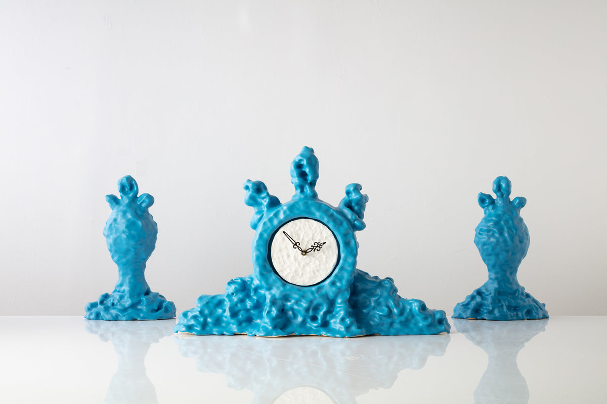 Mantelpiece Clock and Mirrored Urns